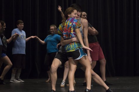 The cast of the fall play work on blocking and dancing.