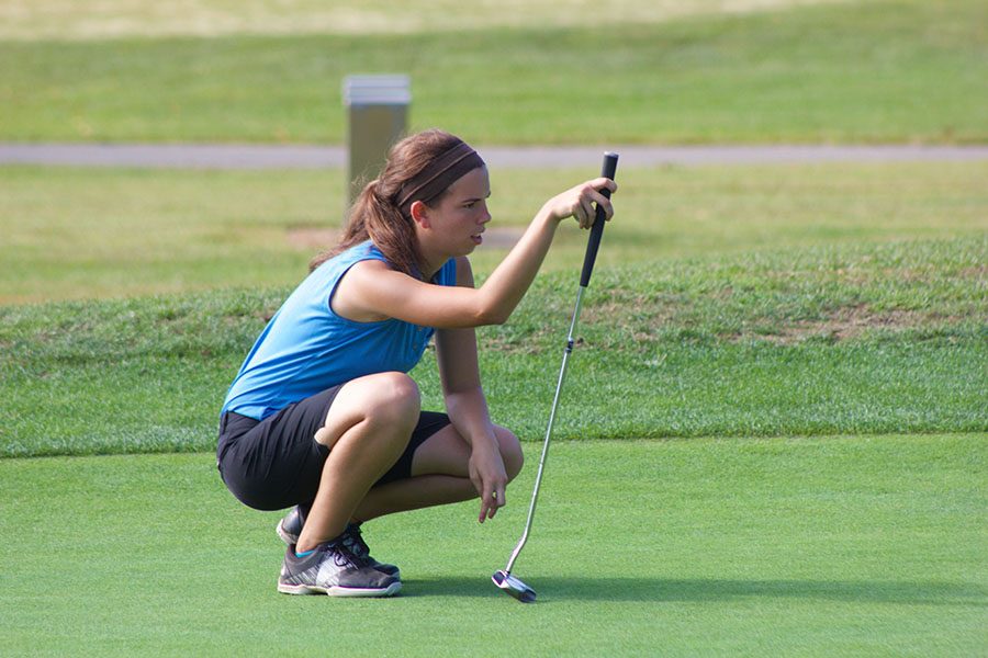Claire Beeler, senior, keeps an eye on her opponent’s play.