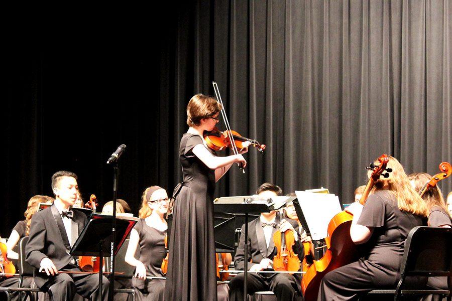Concert+Master+of+the+Freshman+Orchestra+tuning+the+orchestra+before+performing.+2%2F7%2F17