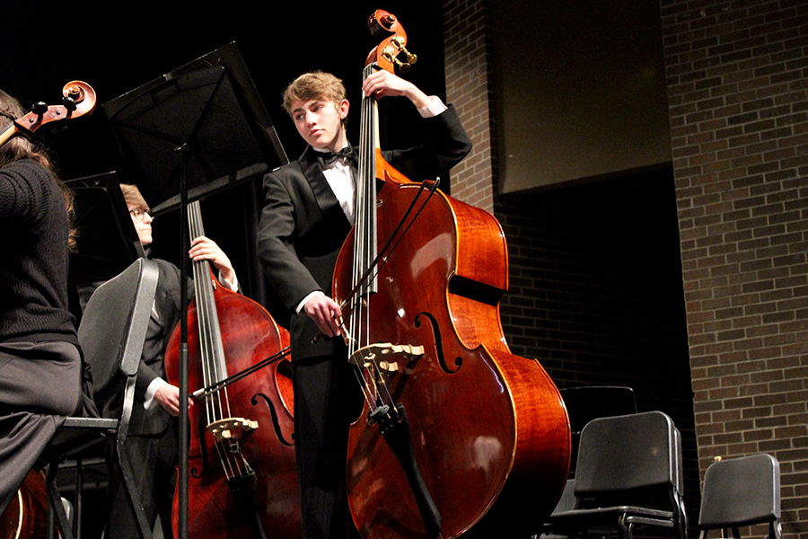 An orchestra student performing a piece April 4.