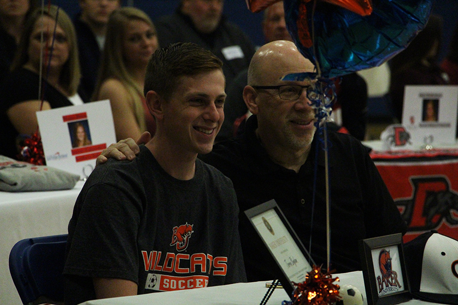 Tarren+Bingham+celebrates+his+signing+to+play+soccer+at+Baker+University+in+the+fall.