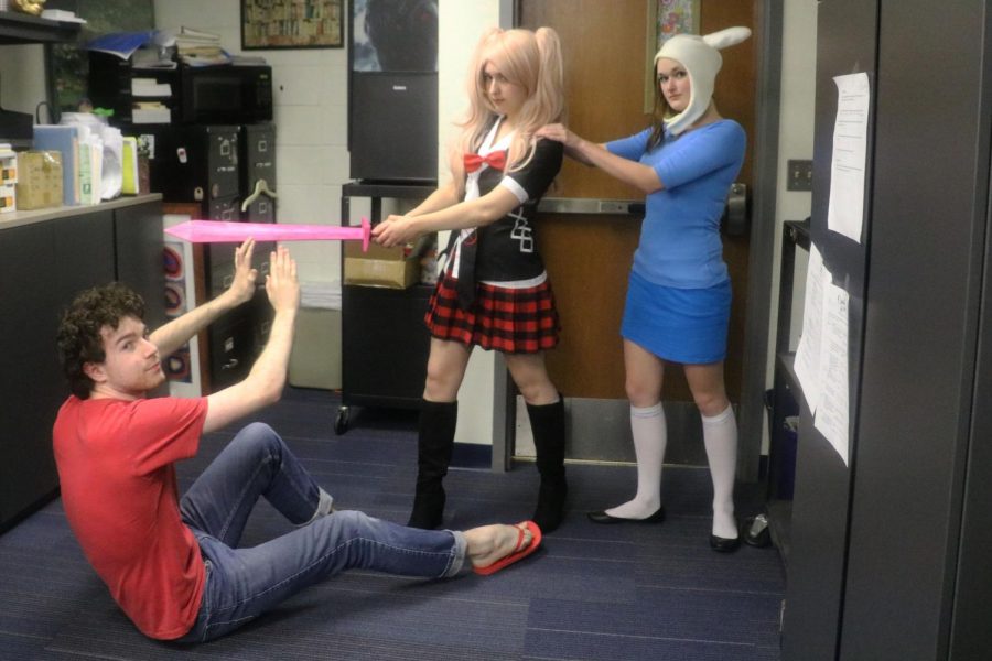Jacob Reiss, Taylor Hawkins and Willow Vaughn, seniors, dressed as Steven Universe, Janko Enoshima, and Fiona the Human (respectively) are shown. Multiple different shows are portrayed in this photo, showing how cosplay can combine different media universes.