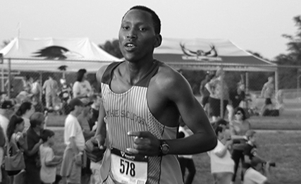 Stevie Micheke, senior, is running at an event at Raymond Peculiar middle school. He is a foreign exchange student from Kenya. His school at Kenya had a cross country club. He did cross country for two years now, and he runs 9-10 miles a day. Running is a very popular sport in Kenya.