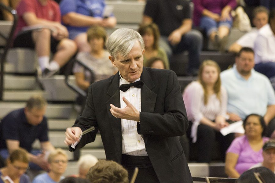 Dr. Mark Laycock, a professor at Wichita State University, conducts the chamber orchestras from each of the Olathe high schools. 