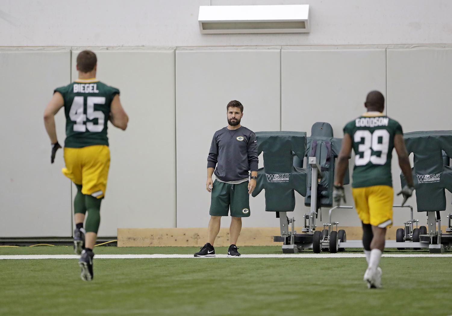 Nate Weir, athletic trainer, is shown above supervising the conditioning of Green Bay Packers players, Vince Biegel and Demetri Goodson. Weir has worked with the Packers as an athletic trainer for a combined total of 17 years.