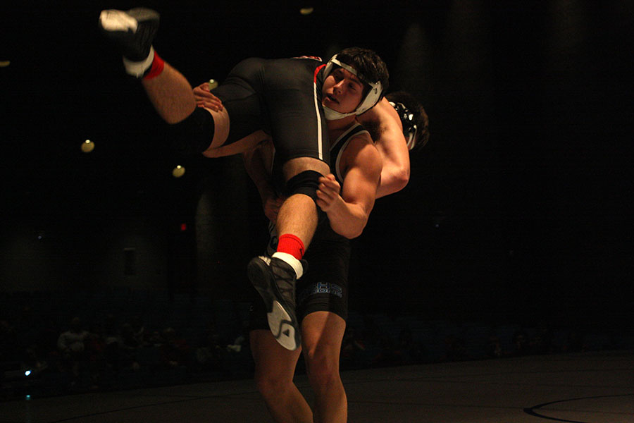 Nick Jouret,senior, competes at a wrestling meet and is in the weight class 182. He has been wrestling for 13 years and recently broke the all-time win record with 146 wins. He is planning on wrestling in college but is unsure where he will attend.