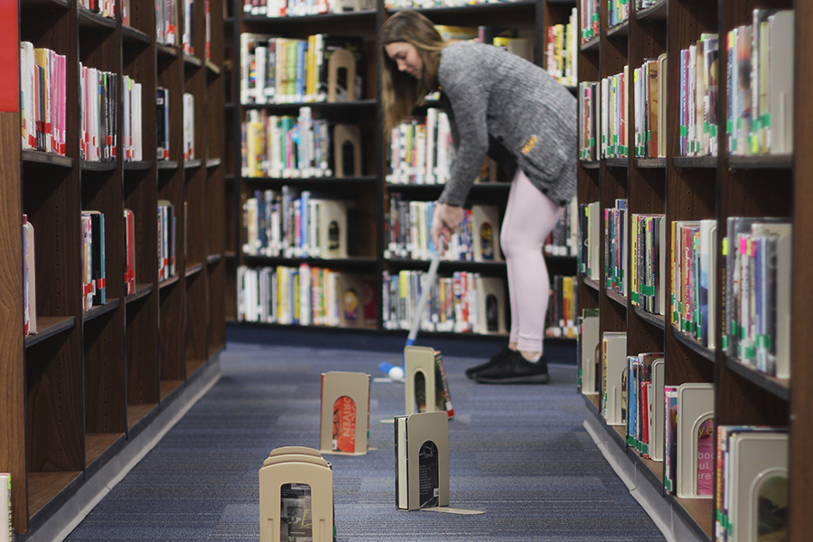 Students took a break from books, and instead played miniature golf in library March 27 after school.