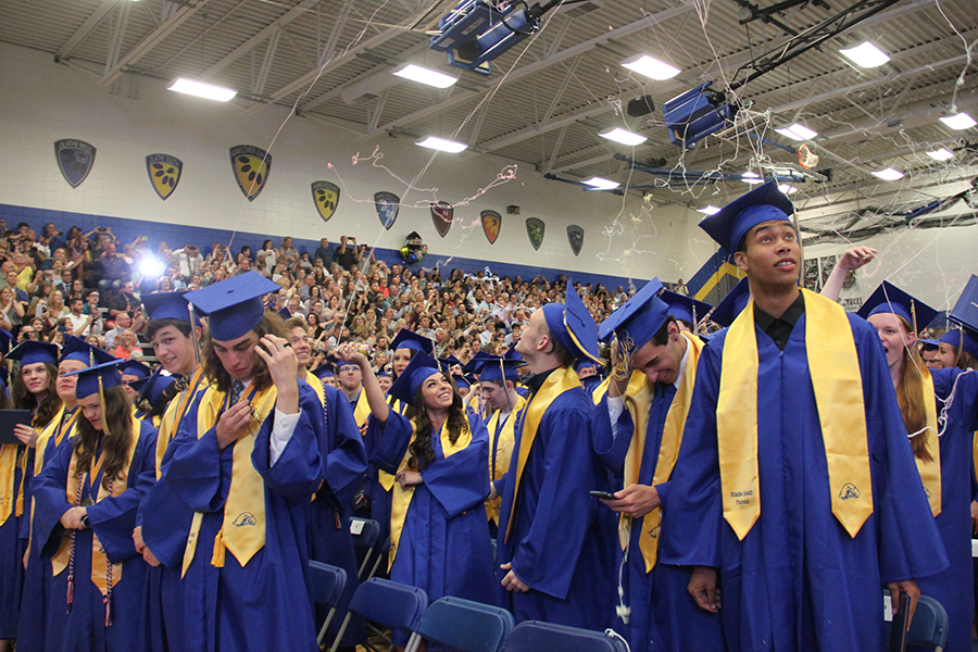 At the end of commencement, seniors celebrated with silly string and some people tried to avoid the mess.