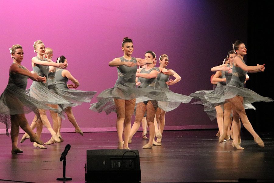 The varsity golden girls performing “Feel Again” at the sping show dance performance on April 28.