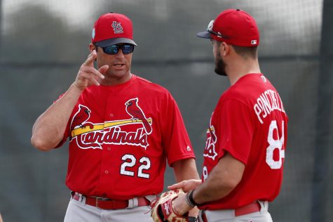 Mike Matheny, Royals manager, talks about pitching with Daniel Ponce de Leon, pitcher, during his time with the St. Louis Cardinals. Matheny was hired as the 20th manager in Royals history.