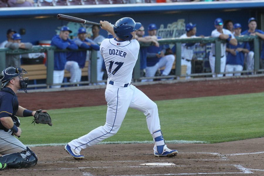 Hunter Dozier, third baseman, hits a ball in a game in Omaha, Nebraska. Dozier got off to a cold start in 2019, but turned his season around into one that out him into the MVP conversation.