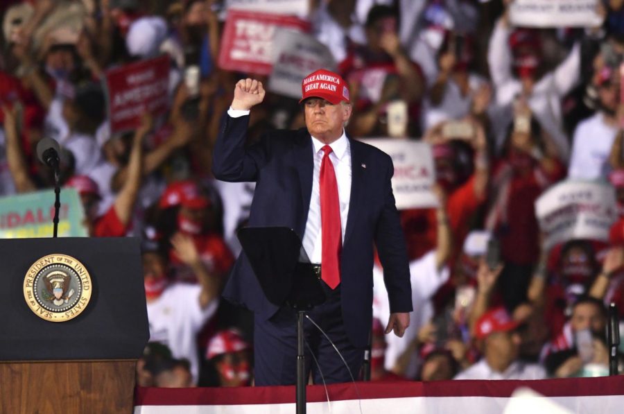 President Donald Trump salutes the crowd following his Nov. 2 rally in Opa-Locka, Florida.