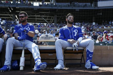 Kansas City Royals outfielders Bubba Starling (left) and Ryan McBroom (right) sit next to each other before the start of a Spring Training game in 2020. Just days later, MLB would suspend its season in the midst of the COVID-19 pandemic.